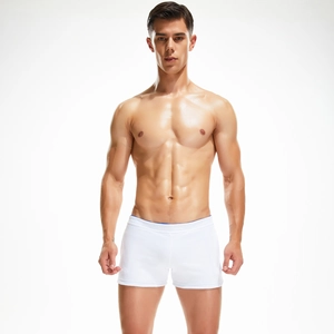 Close-up of white slim fit men's cotton boxer briefs with blue waistband detail