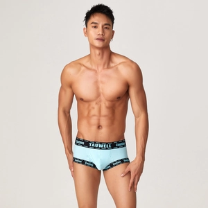Close-up of light blue ribbed fabric and elastic waistband with brand lettering on men boxers