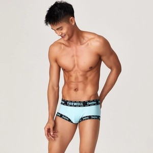 Detail view of light blue ribbed sports boxer briefs with logo waistband and caution prints