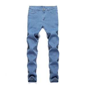 Flat lay close-up of light blue slim fit jeans with classic five-pocket design details