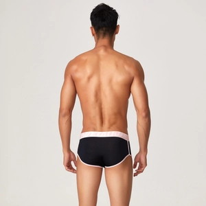 Detail showing back view of men's modal trunk with pink elastic waistband and black fabric