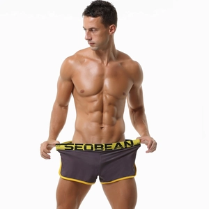 Detail of men's low-rise athletic boxers with wide elastic waistband and brand logo