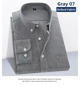 Detail of grey Oxford cotton fabric texture and buttoned chest pocket on long sleeve shirt