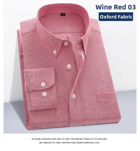 Detail of burgundy Oxford fabric shirt with button-down collar and chest pocket