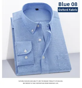 Detail view of men's Oxford blue shirt showing fabric texture, button collar and chest pocket