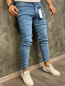 Men's slim fit light blue skinny jeans with wash effect and elastic crease details