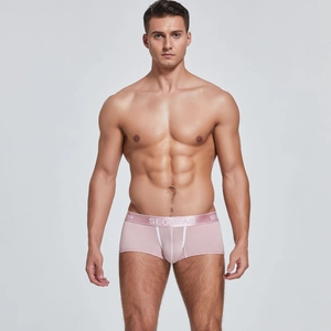 Detailed view of pink men's boxer briefs with elastic waistband and U-convex design