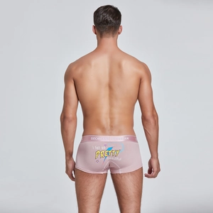 Detail view of pink men's trunks featuring elastic waistband and retro print on back