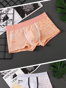 Detailed view of men's trunks with chemical formula print and wide waistband