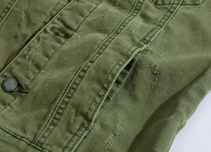Detail view of army green denim vest featuring distressed texture and metal buttons