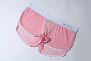 Detailansicht der rosa atmungsaktiven Mesh-Boxershorts mit weißem elastischem Bund