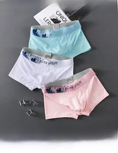 Detail of low-rise men's boxer briefs showing breathable ice silk fabric and wave print