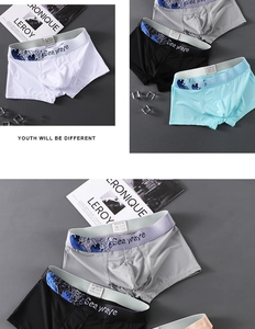 Detailed view of elastic waistbands with wave patterns on four colors of men's boxer briefs