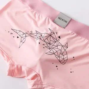 Men's low-waist boxer briefs with pink knit fabric and black geometric shark print