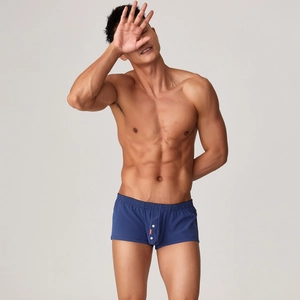 Détail du boxer tissé à carreaux bleu marine pour hommes avec taille élastique et bouton