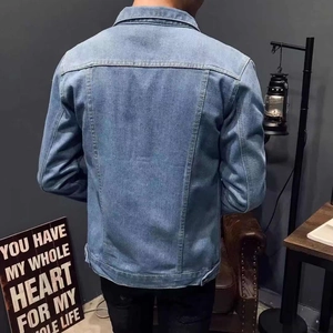 Back view of a casual men's denim jacket showing structural seams and vintage styling