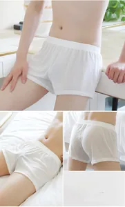 Men's loose white mesh boxer shorts featuring breathable fabric and elastic waistband
