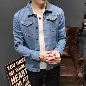 Detail view of light blue denim jacket featuring classic collar and metal buttons