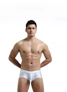 Close-up of white knitted men's boxers with a silver logo on the waistband