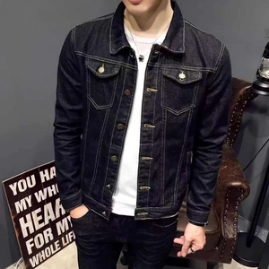 Detail of dark blue denim jacket with contrast stitching and metallic buttons