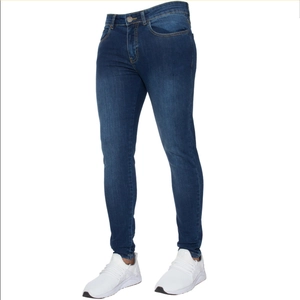 Detail of skinny fit navy denim jeans featuring natural whiskering and five-pocket design