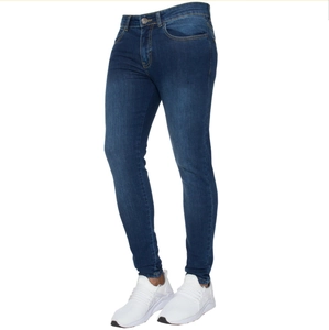 Detailed close-up of dark blue slim fit jeans with classic metal button and zip fly closure