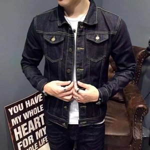 Close-up of men's indigo denim jacket with yellow contrast stitching and metal buttons