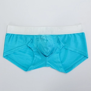 Macro shot of breathable blue men's trunks with elastic wide branded waistband
