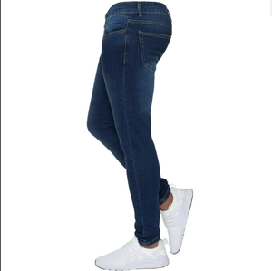 Detail view of slim fit dark blue men's stretch jeans with classic back pocket and seams