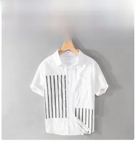 Detail view of men's casual short-sleeve shirt with black vertical striped patchwork