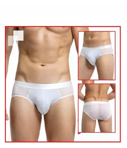 Detailed view of men's white heart-patterned sheer mesh briefs with elastic waistband