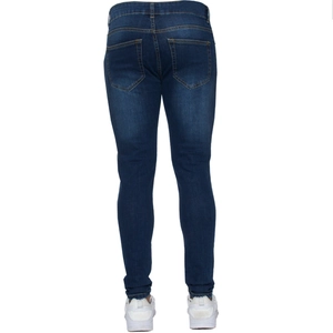 Detail view of men's slim fit dark blue jeans with back pocket stitching and tapered leg