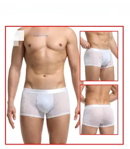 Three-way view of white heart-pattern mesh boxer briefs showing fit and texture