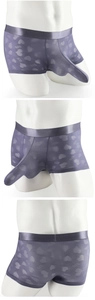 Detailed view of purple men's sheer boxer briefs with heart prints and 3D pouch design
