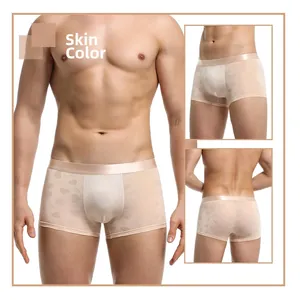 Detail view of sheer men's boxer briefs with heart and 520 jacquard pattern in skin tone