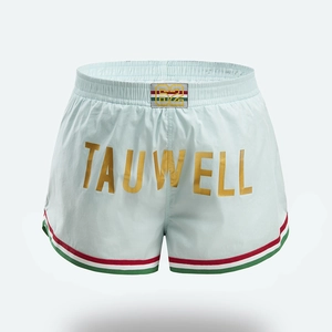 Detail of light blue men's athletic shorts with gold branding and tricolor striped piping