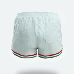 Rear view of mint green sports shorts showing elastic waistband and back pocket detail