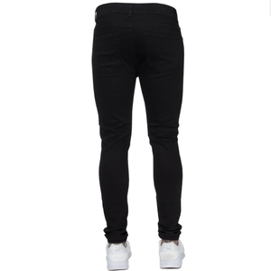 Rear view of men's slim fit black skinny jeans with classic back pockets and white sneakers