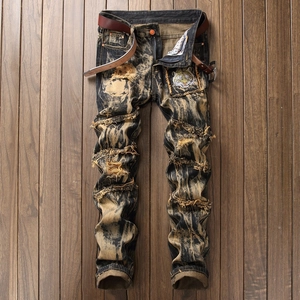 Men's vintage distressed slim fit jeans with tiger embroidery and acid wash finish