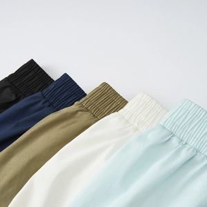 Detail view of elastic waistbands on men sports shorts in five versatile colors