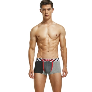Detail of men's low-rise boxer briefs with tricolor patchwork design and elastic waistband