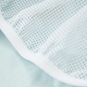Detail of breathable white mesh lining with durable edge binding for men's casual shorts