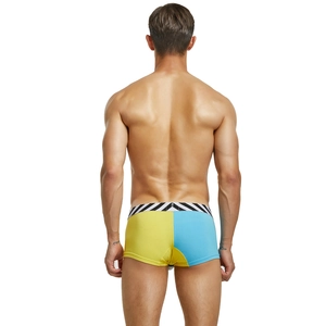 Rear view of men's low-rise boxers featuring yellow and blue color-block knit design