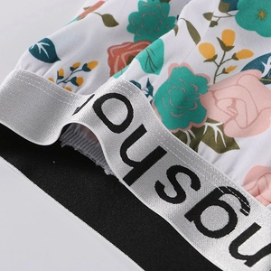 Men's loose floral print boxers with silver OUSBU elastic waistband and rose pattern
