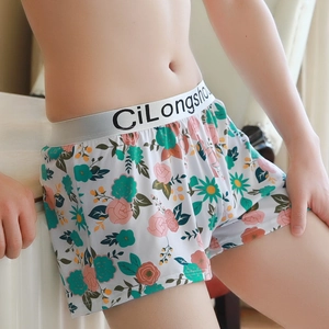 Men's loose boxer shorts with pink rose and green floral print on soft white fabric