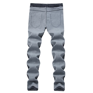 Jean slim gris extensible pour homme avec taille contrastée et effet de jambe plissé