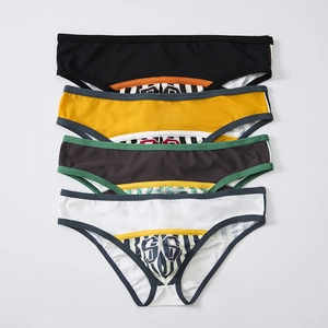 Detailed view of four pairs of men's low-waist mesh briefs with athletic number 56 print