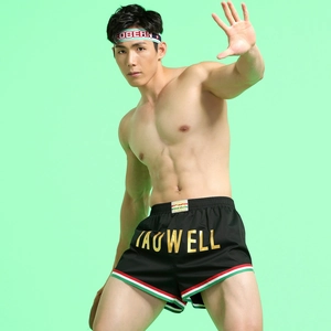 Detail of Tauwell men's athletic shorts featuring side stripes and logo print