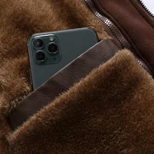 Men's retro slim-fit brown PU leather jacket featuring plush lining and internal phone pocket