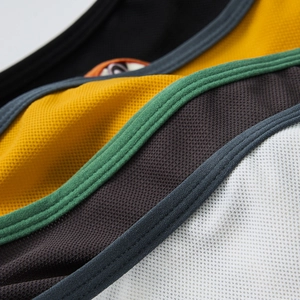 Detail of breathable mesh fabric and double-stitched seams on patchwork men's briefs